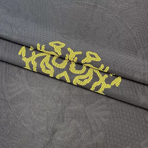 Трикотажное полотно FRTX 25 004 Адыгея темно-серое с орнаментами в цвет полотна и ярко-желтым