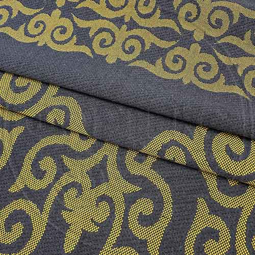 Трикотажное полотно FRTX 25 005 Адыгея (Матрасная ткань) темно-серого цвета с желтым орнаментом
